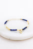 Tiana Bracelet - Pacific-Zafino-Gold plated with Pacific blue details and freshwater pearls, this bracelet is perfect for coastal elegance. *18K Gold Plated Solid Stainless Steel Base *17.5cm Elastic *Water proof: Can be worn in the ocean or pool-Pash + Evolve