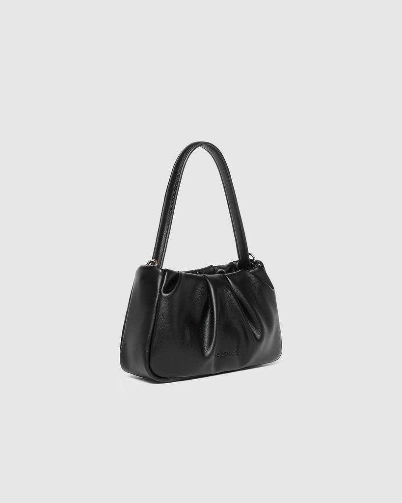 Uma Handbag - Black-Louenhide-The Uma Black Handbag is your go-to plus-one for everything from elegant events to leisurely long lunches. Crafted from smooth vegan leather with a softly ruched silhouette, this versatile mini top handle bag moves effortlessly from day to night. Balancing timeless style with practical design, Uma Black offers three ways to wear: as a small crossbody with chain for a touch of glamour, with the sleek leather shoulder strap for a refined finish, or without straps for a polished c