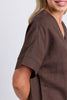 Wander top - coffee-Elm-Easy to wear and beautifully flattering, the Wander Top is designed with a soft V-neckline, centre front pleat and gently curved hem for effortless everyday style. Crafted from a breathable linen blend, it drapes beautifully and pairs perfectly with denim, relaxed linen pants or the matching Wander Pant. V neckline Pleat at centre front Curved hemline Relaxed fit 55% linen 45% viscose The Model is 173cm and is wearing a size 10-Pash + Evolve
