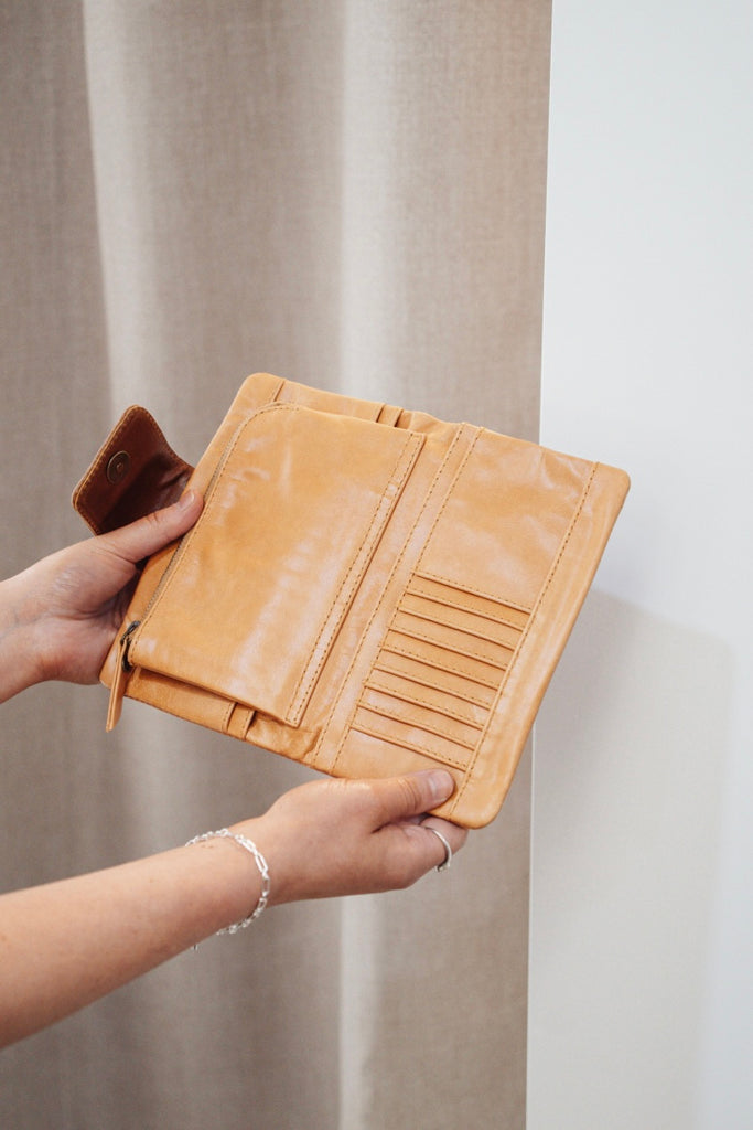 Zuri 2 tone wallet - Light tan with vintage tan-Baleka Leather-Bold design meets everyday functionality with the Zuri 2-Tone Wallet. Featuring striking two-tone detailing, this modern classic adds a pop of personality to your essentials. The press-stud closure opens to reveal a smart interior, including a mini coin purse, 4 note dividers, and 18 card slots — giving you plenty of space to stay organized in style. Chic yet practical, the Zuri Wallet is perfect for those who love a statement accessory that bal