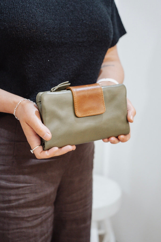 Zuri 2 tone wallet - Olive green with vintage tan-Baleka Leather-Bold design meets everyday functionality with the Zuri 2-Tone Wallet. Featuring striking two-tone detailing, this modern classic adds a pop of personality to your essentials. The press-stud closure opens to reveal a smart interior, including a mini coin purse, 4 note dividers, and 18 card slots — giving you plenty of space to stay organized in style. Chic yet practical, the Zuri Wallet is perfect for those who love a statement accessory that b