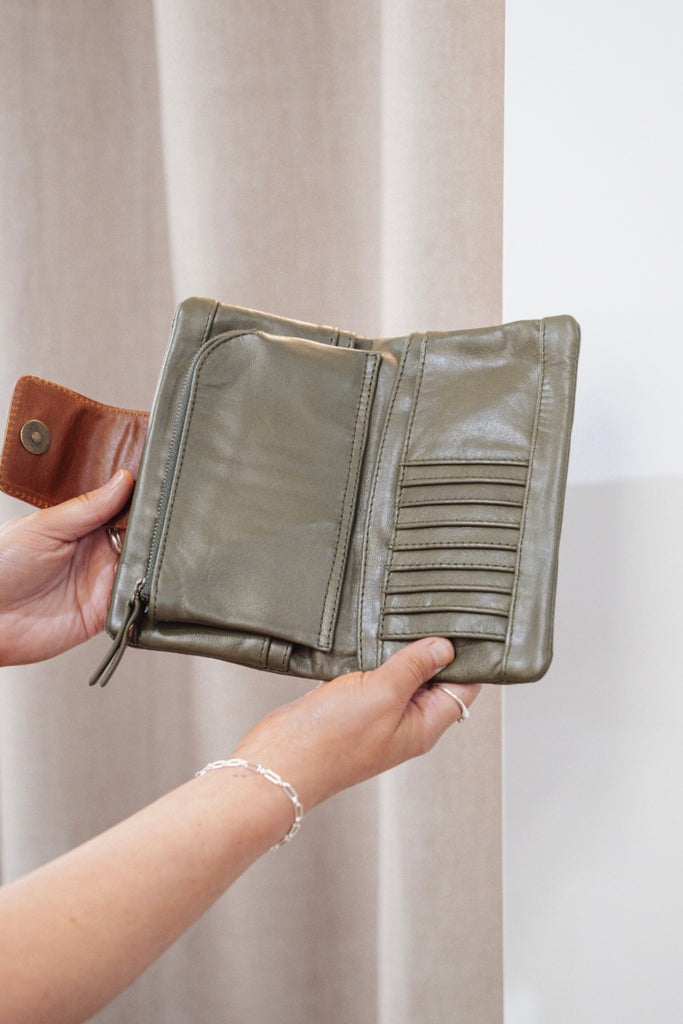 Zuri 2 tone wallet - Olive green with vintage tan-Baleka Leather-Bold design meets everyday functionality with the Zuri 2-Tone Wallet. Featuring striking two-tone detailing, this modern classic adds a pop of personality to your essentials. The press-stud closure opens to reveal a smart interior, including a mini coin purse, 4 note dividers, and 18 card slots — giving you plenty of space to stay organized in style. Chic yet practical, the Zuri Wallet is perfect for those who love a statement accessory that b