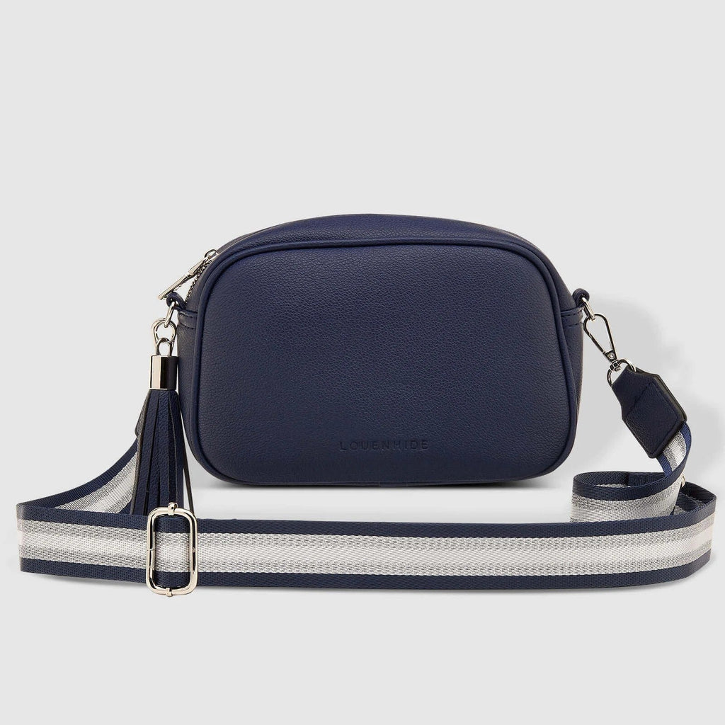 Jacinta Metallic Crossbody Bag - Navy-Louenhide-Bags-The Louenhide Jacinta Crossbody Bag is the ultimate cool-girl bag, featuring a complimentary detachable metallic guitar strap. Feel luxe and sporty with our Jacinta over your shoulder. Walk out in style with a fun tassel feature and secure your essentials with its slip and zip pockets. *100% Polyurethane Vegan Leather *Stripe Lining *95-140cm Webbing Guitar Strap *113-129cm PU Extension Strap *Silver Hardware *W22 x H15 x D7cm-Pash + Evolve