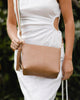 Kasey Stripe Strap Bag - Camel-Louenhide-Bags-The Louenhide Kasey Tan Crossbody Bag with Stripe Strap is a classic women's everyday bag with elevated style. Designed in a soft and slouchy design, this casual crossbody bag is a smaller take on our best-selling Daisy Crossbody Bag. Secure your favourite products in either the zip pocket, the two slip pockets or in the interior compartment for your bigger items such as sunglasses, purse and phone with ease. Complete your relaxed luxe look with the matching str