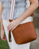 Kasey Stripe Strap Bag - Tan-Louenhide-Bags-The Louenhide Kasey Tan Crossbody Bag with Stripe Strap is a classic women's everyday bag with elevated style. Designed in a soft and slouchy design, this casual crossbody bag is a smaller take on our best-selling Daisy Crossbody Bag. Secure your favourite products in either the zip pocket, the two slip pockets or in the interior compartment for your bigger items such as sunglasses, purse and phone with ease. Complete your relaxed luxe look with the matching strip